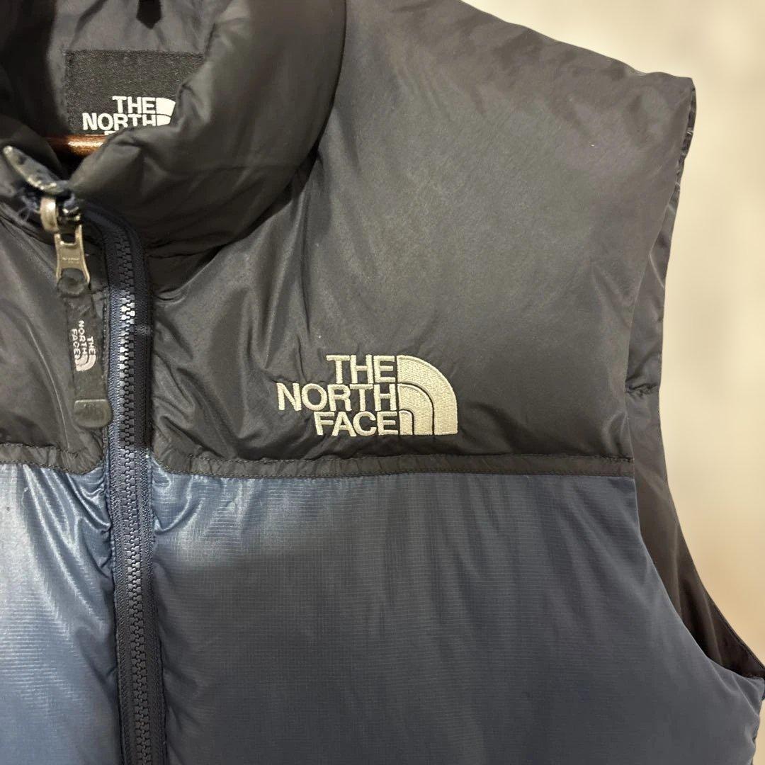 ノースフェイスヌプシダウンベスト700フィル刺繍口ゴドローコード