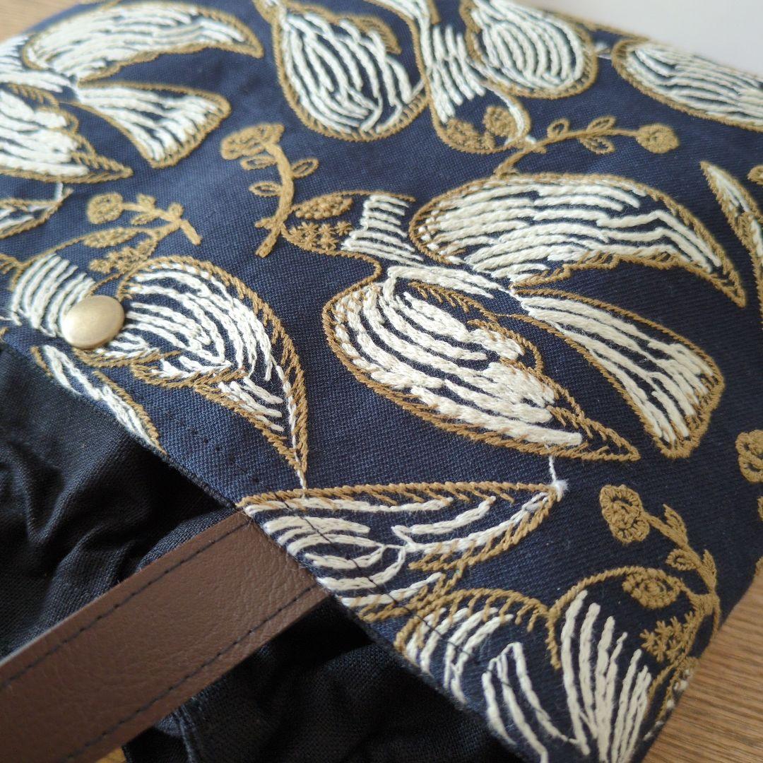 あおりポケットの巾着バッグ＊ミナペルホネン following day