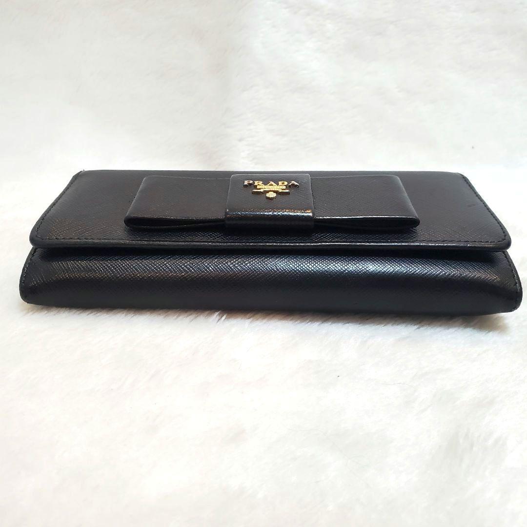 美品 プラダ　長財布 サフィアーノ フィオッコ ライト黒 メタルロゴ リボン